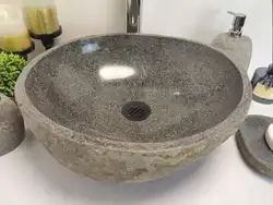 Stone sink in the bath photo