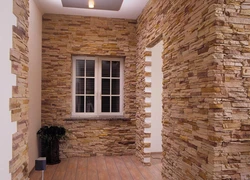 Decorative stone in the interior of the hallway with your own