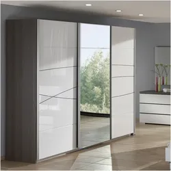 Bedroom wardrobe with mirror for three doors photo