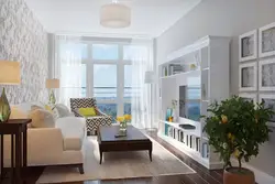 Living room design in an apartment with a balcony and window