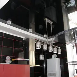 Kitchen interior with suspended black ceiling