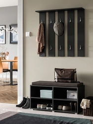 Wall-mounted shoe racks in the hallway photo