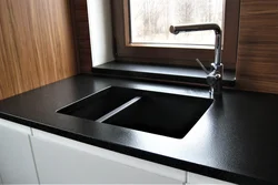 Black countertop black kitchen photo