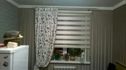 Roller blinds with tulle in the kitchen interior