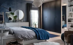 Gray wardrobe in the bedroom interior photo