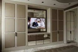Wardrobe with built-in TV in the living room photo