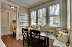 Photo of a kitchen with a dining table by the window