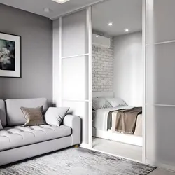 Bed in the closet in a studio apartment design