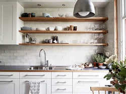 Photo of a kitchen with shelves and cabinets on the wall