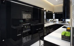 Photo of a kitchen with a black countertop and a black refrigerator