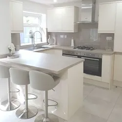 Interior of a bright kitchen with a bar counter