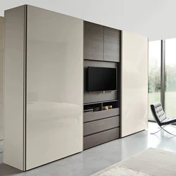 Wardrobe with a niche for a TV in the living room photo