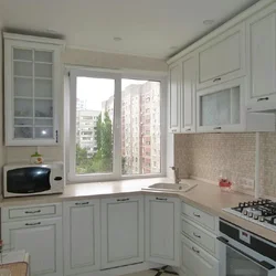 Kitchen corner photo with sink by the window