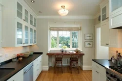 Kitchen interior in a house with window and door