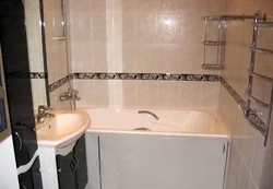 Photo Of A Bathtub After Renovation With Tiles In An Apartment