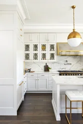 White kitchen with gold handles photo