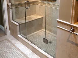 Photo of a bathtub with a shower screen without a tray