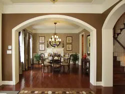 Entrance to the living room without a door in a modern interior