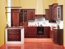 Cherry-colored kitchen in the interior photo