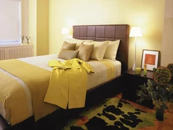 Yellow bed in the bedroom interior