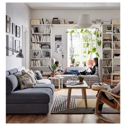 Books in the interior of the living room photo in a city apartment
