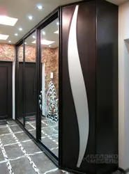 Wardrobe doors with mirror in the hallway photo