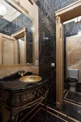 Bathroom interior black and gold