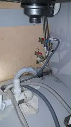 Photo of how to connect a washing machine in the kitchen