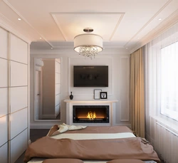 Bedroom with fireplace and TV photo