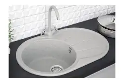 Kitchen with a round sink made of artificial stone photo