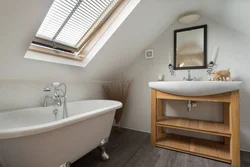 Bathroom design with a window in the attic