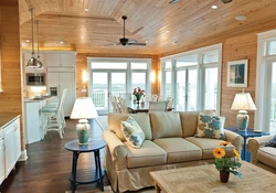 Kitchen and living room at the dacha in a wooden house photo