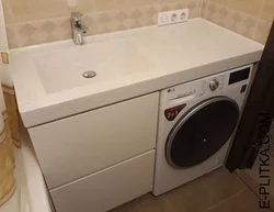 Cabinet for washing machine in bathroom photo