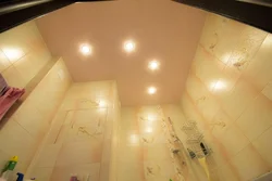 Lighting in the bathroom with suspended ceiling photo in the interior