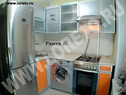 Kitchen design with geyser and washing machine photo