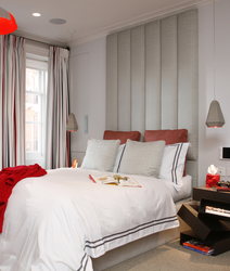 Red curtains in the bedroom interior