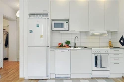 Light refrigerator in the kitchen interior