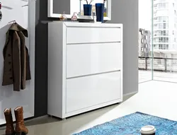 Chest of drawers with shoe rack in the hallway photo