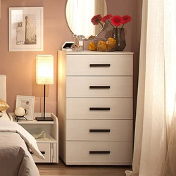 Chests of drawers in the design of a small bedroom with photos