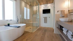 Bathtub with wooden floor photo