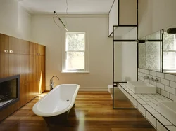 Bathtub with wooden floor photo