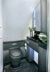 Gray toilet in the bathroom interior