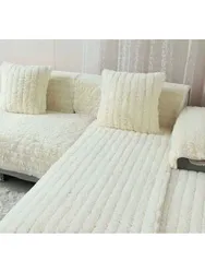 Қонақ бөлмесінің фотосындағы дивандағы көрпе