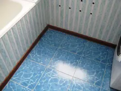 Baseboard for bathroom floor on tiles photo