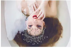 Photo in a milk bath with flowers