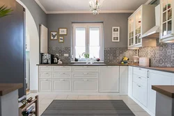 Beige kitchen with gray countertop in the interior