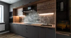 Dark kitchen with wooden countertop in the interior