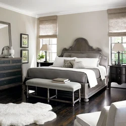 Gray bedroom interior with brown furniture