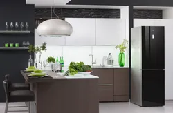 Black refrigerator in the kitchen interior
