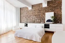 Brick wallpaper in the bedroom interior